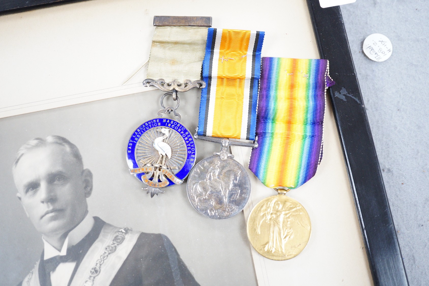 A WWI pair, silver masonic medal and soldier's small book